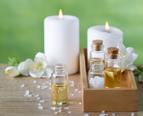 Obraz na płótnie Canvas Aromatherapy essential oils, candles,flowers and sea salt