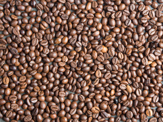 Roasted coffee beans background , captured from top view with sharp focus