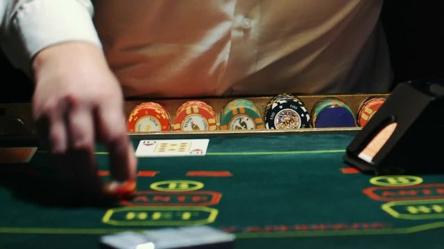 playing poker. dealer deals the cards and the game begins.