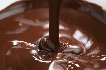 macro photo of premium dark chocolate pour in bowl, shallow focus