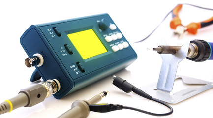 Modern digital signal oscilloscope and tools isolated on white background closeup - obrazy, fototapety, plakaty