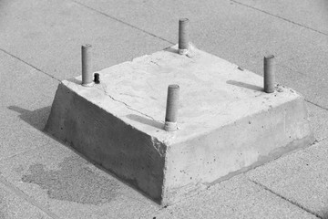 Bolts in a concrete base for fastening - black and white