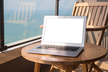 Workplace with laptop on the background of the sea