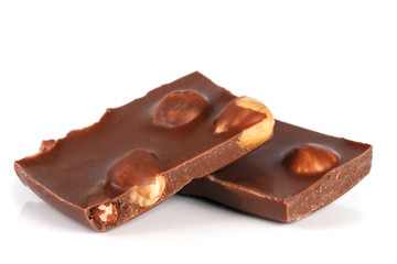 Chocolate with hazelnuts isolated on white background