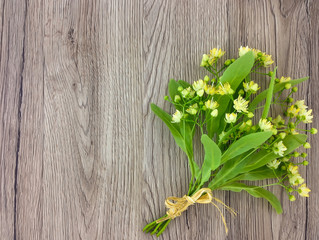 Still life with linden flowers bouquet. Flat lay, top view