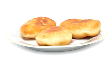 Fresh baked russian pastry pirozhki isolated on white