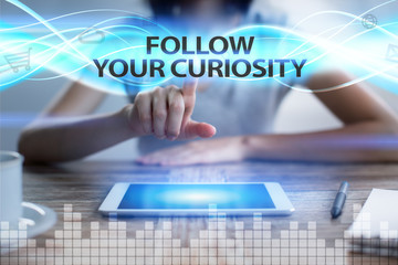 Woman using tablet pc, pressing on virtual screen and selecting follow your curiosity.