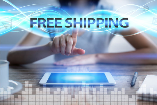 Woman using tablet pc, pressing on virtual screen and selecting free shipping.