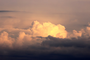 Sunset with sun rays, sky with clouds and sun.