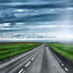 Empty road leading to snow covered mountains, Beautiful landscape in early autumn of Iceland