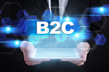 Businessman holding tablet PC with b2c concept.