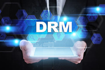 Businessman holding tablet PC with drm concept.