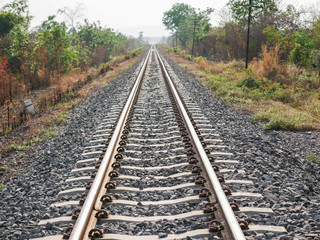Fototapeta na wymiar Railroad with vanishing point, parallel and infinity, railway background