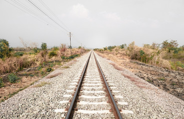 Fototapeta na wymiar Railroad with vanishing point, parallel and infinity, railway background