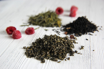 assortment of dry tea on wooden background