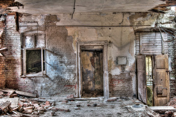 Fototapeta na wymiar Door and window in old, abandoned and crumbling building