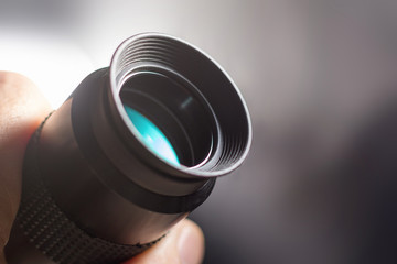 Telescope eyepiece with rubber eyecup, hand hold