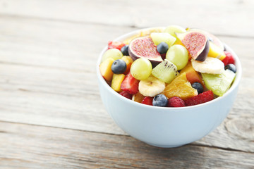 Fresh fruit salad on a grey wooden table