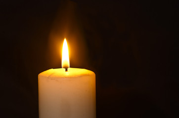 the flame of a burning candle