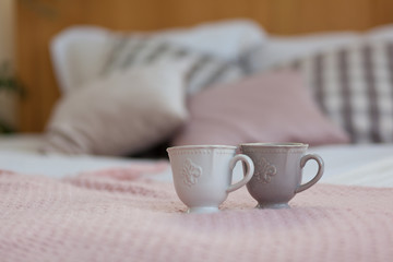 Two cups of coffee on a tray. Breakfast in bed