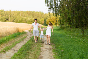Fototapeta premium Portrait of beautiful young future parents outdoors