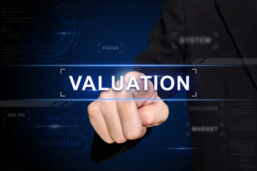 business hand pushing valuation button on virtual screen