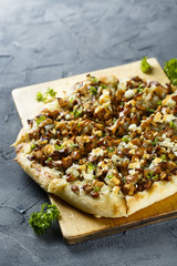 Pizza with mushrooms and herbs