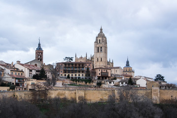An iconic view to the center of Segovia, Cathedral and old medieval buildings over the hill, Segovia, Castille and Leon, Spain.