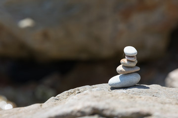 stones stand on each other covered with cobwebs 