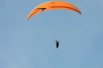 hang-gliders on a background of clear sky