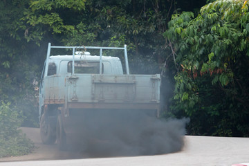 black smoke from the exhaust pipe of a truck