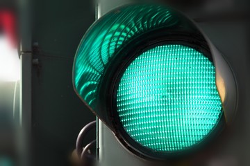 Green traffic light close up.