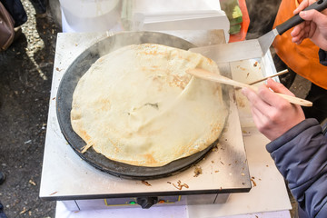 Cooking pancake outdoors