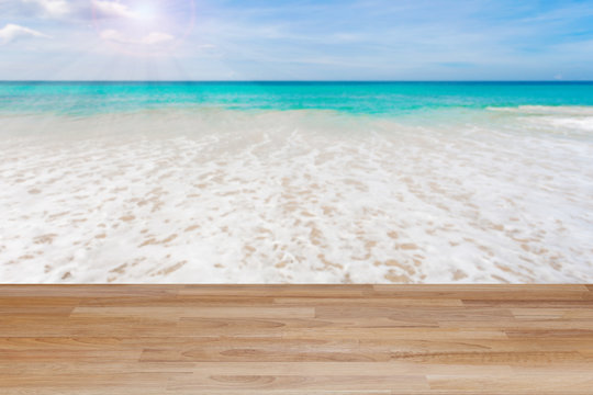 Wood table floor on beach , tropical sea scenery background.