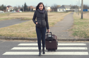 Fototapeta premium Full length portrait of a pretty traveler