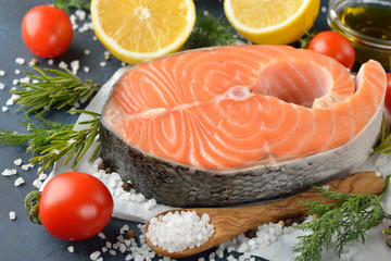 Raw salmon steak and ingredients