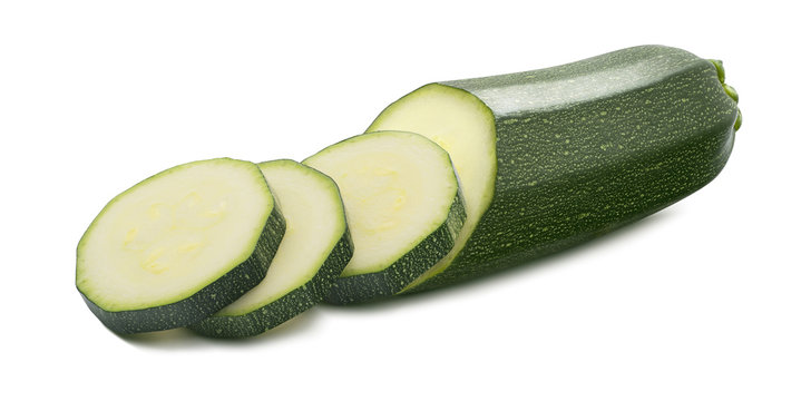 Single zucchini cut pieces isolated on white background