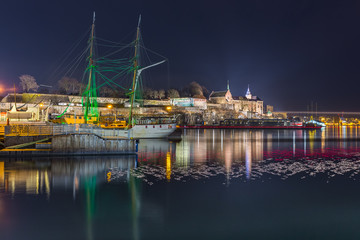 Night view of the Akershus Fortress in Oslo, Norway. View from the Aker Brygge Marina. Oslo, Norway.
