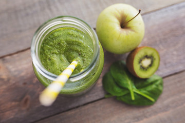 Healthy smoothie made from apple, kiwi and spinat.