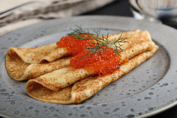 Blinis with red caviar