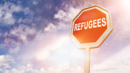 Refugees, text on red traffic sign