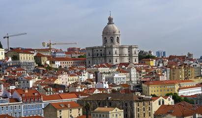 View from the River Tagus of the colorful hilly Lisbon, Portugal