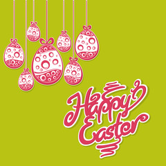 Hanging Easter red eggs and lettering on green. Ornament