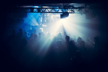 People dance on music in nightclub