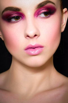 Beauty Fashion Model Girl with pink make-up, close-up studio shoot