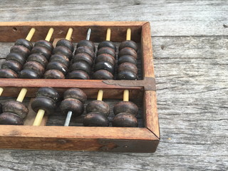 abacus , ancient calculator on wooden background with copy space for  text-Business and financial concept