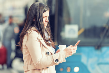 Fototapeta premium Woman using her smart phone
