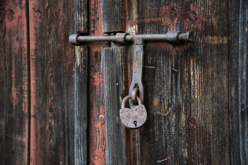 The old door locked with a padlock hanging brackets. Set of backgrounds