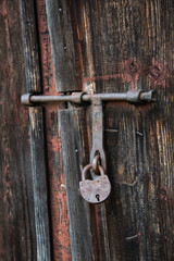 The old door locked with a padlock hanging brackets. Set of backgrounds