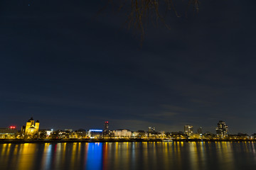 Panorama and cityscape of Cologne over the Rein river at night